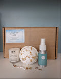  kit with a box, candle, bath bomb, and spray bottle