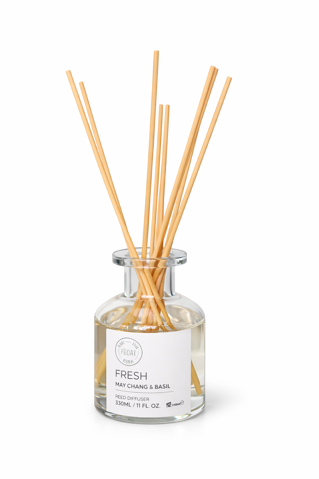 Reed diffuser with wooden sticks in a clear bottle on a white background

