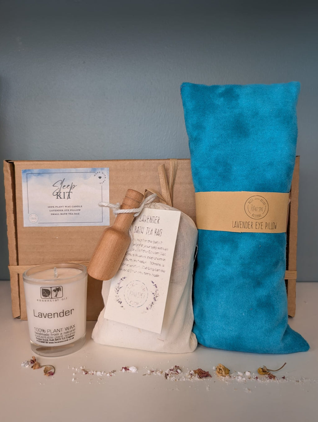 Sleep kit with lavender eye pillow, candle, and bag of Epsom Salt