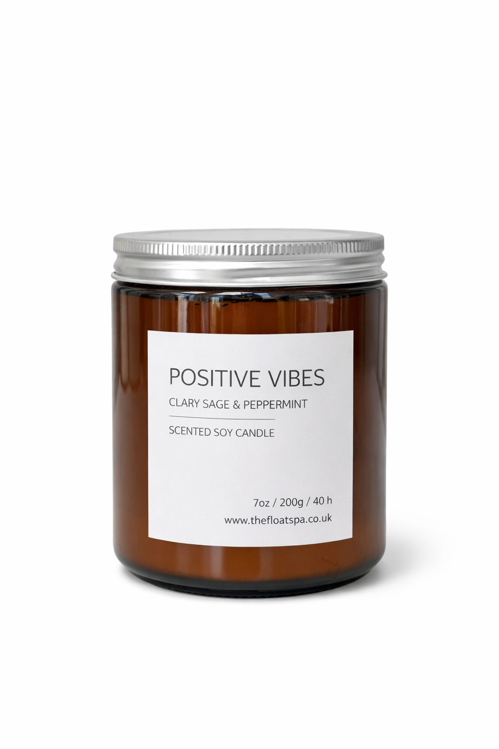 Scented candle labeled 'Positive Vibes' with a white label on a white background


